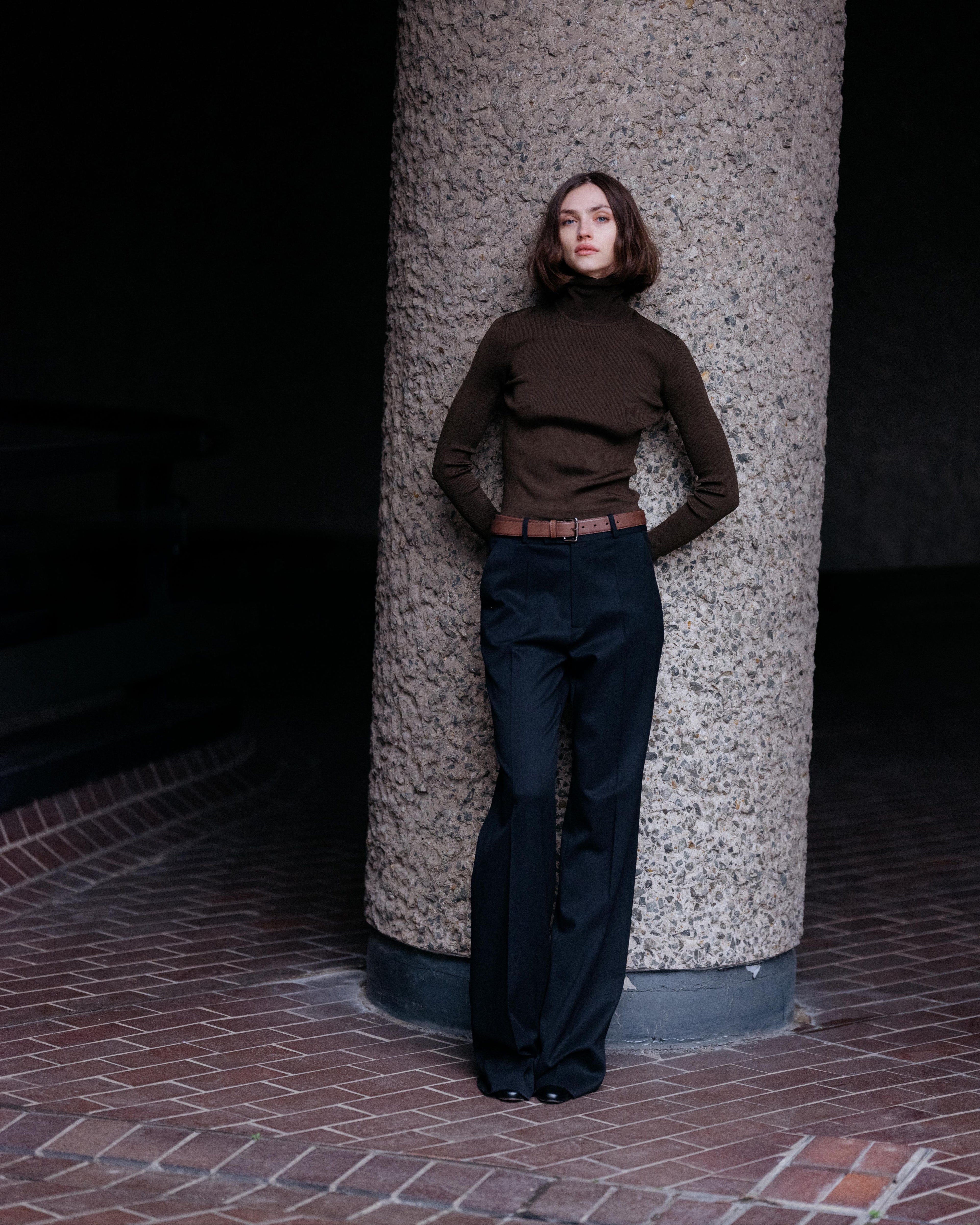 Olive green Evanne silk crepe turtleneck knitwear by Veronica De Piante, close-up of the textured fabric and high neckline.