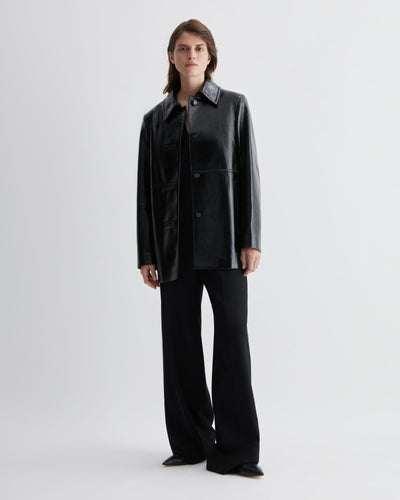 Black Jess jacket in patent leather by Veronica De Piante, stylish coat featuring glossy finish and tailored fit.
