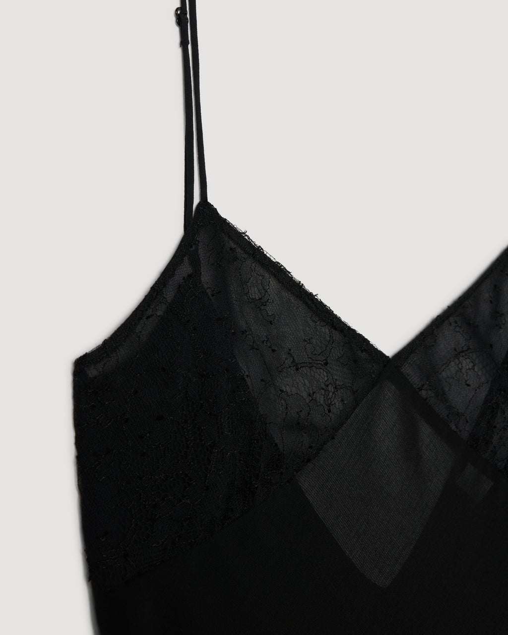 Martina black camisole packshot: semi-sheer wool, Chantilly lace cups, Georgette lining, adjustable strap