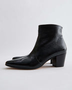 Black patent leather Paloma boots by Veronica De Piante, stylish shoes with sleek, shiny finish and modern design.