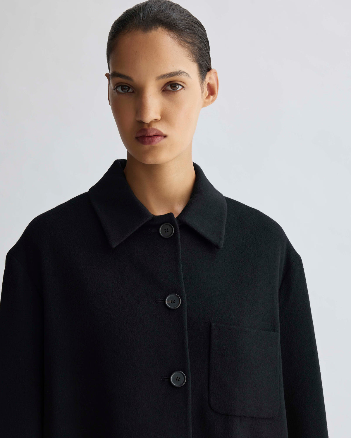 Black luxury wool blend collared relaxed fit jacket with button front and single patch pocket