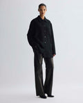 Amaia Jacket in black cashmere, oversized fit, collared with button-front and patch pockets, modeled