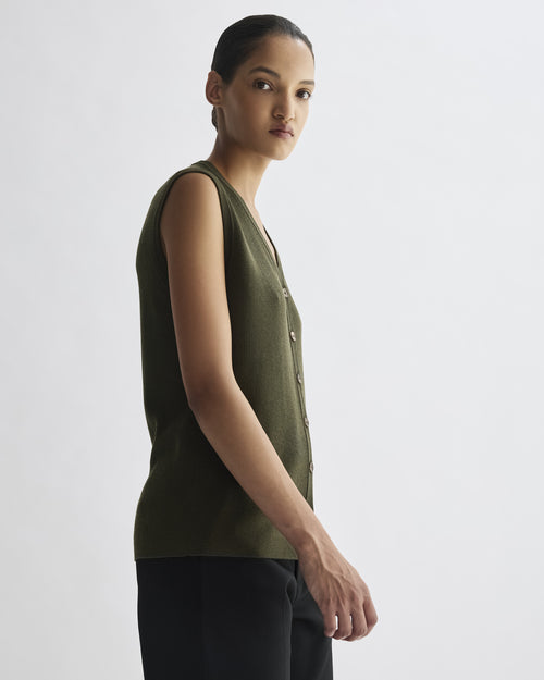 Fitted olive fine merino wool Alice Vest, sleeveless knit with clean silhouette, ribbed texture, and horn buttons