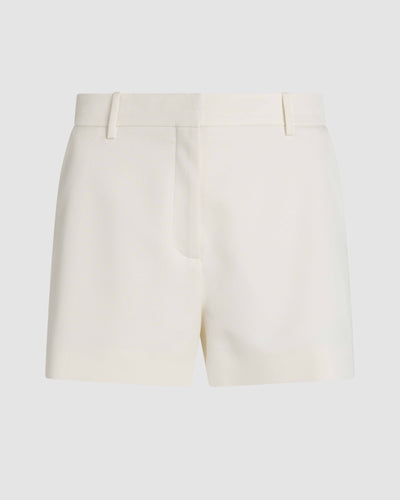 Off-white silk Belle shorts by Veronica De Piante, shown as stylish, lightweight bottoms with a smooth, luxurious fabric finish.