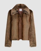 Veronica De Piante Mireia Faux Fur Camel Jacket displayed on a hanger, showcasing the cozy, stylish coat for women.