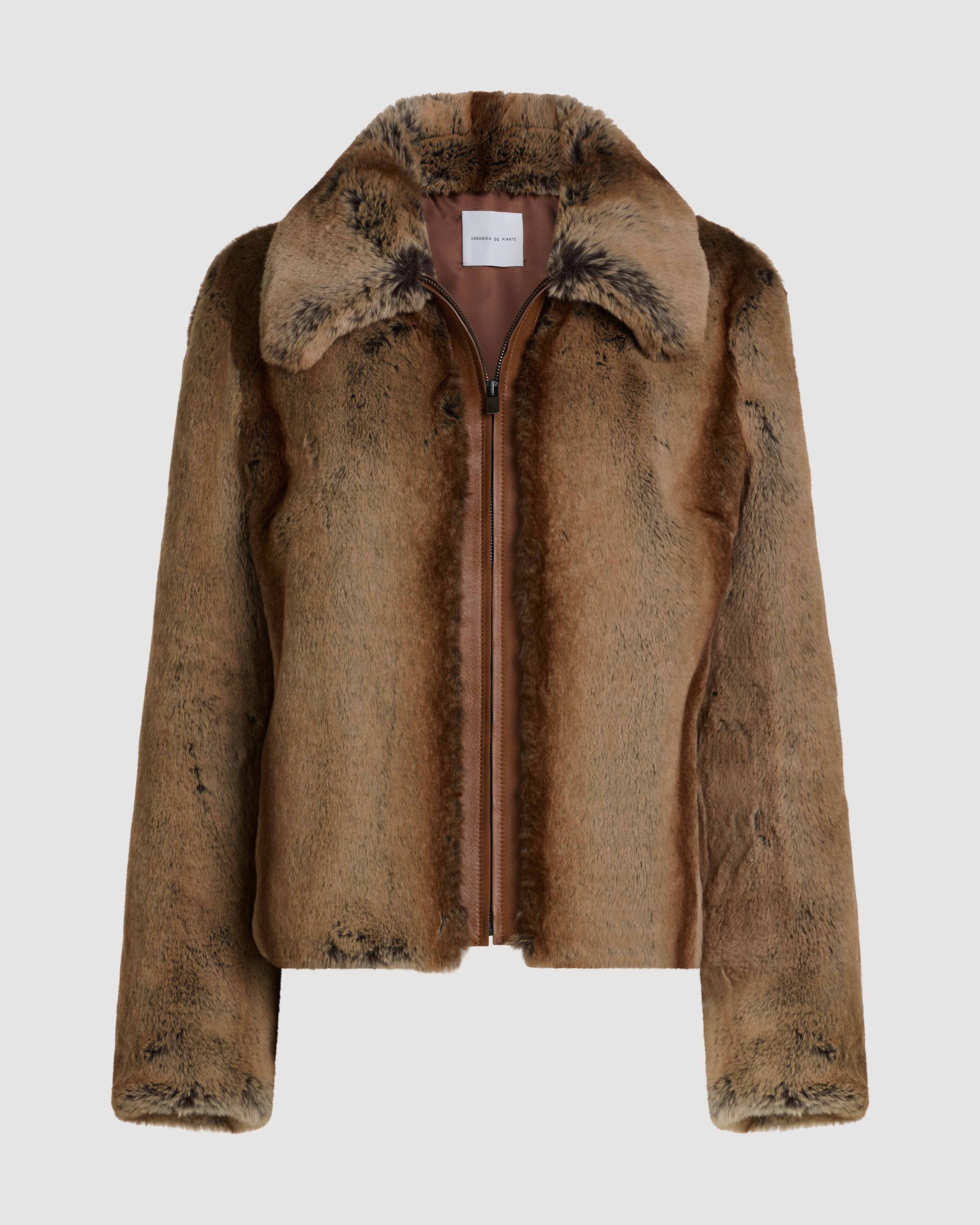 Veronica De Piante Mireia Faux Fur Camel Jacket displayed on a hanger, showcasing the cozy, stylish coat for women.