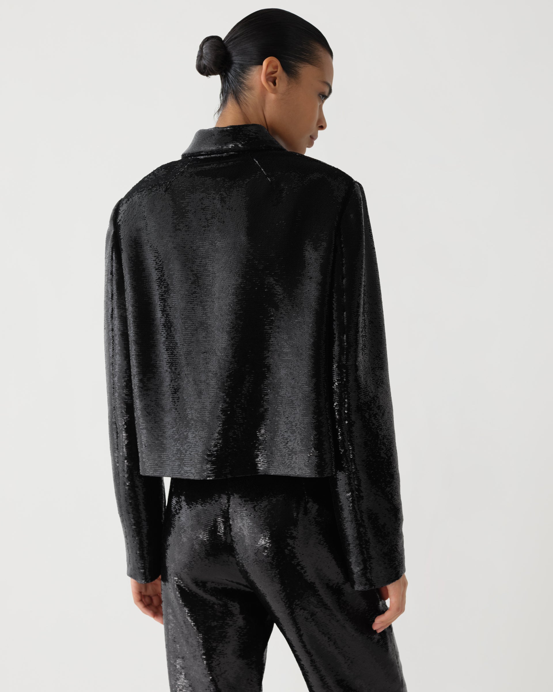 Black Ines jacket by Veronica De Piante with flat sequins, stylish coat featuring shimmering sequin details.
