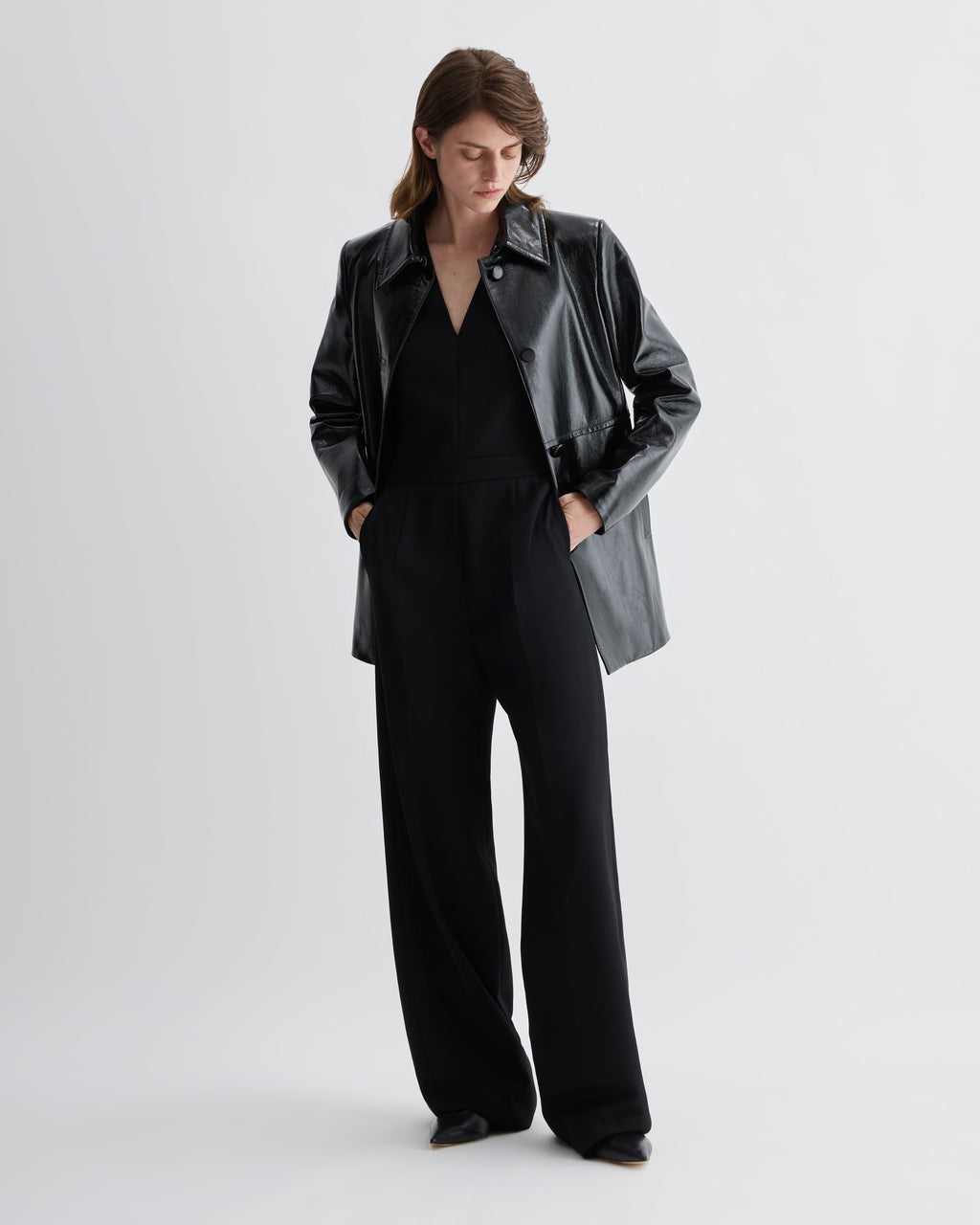 Black Veronica De Piante Jess Jacket in patent leather, stylish coat with a sleek, shiny finish and tailored fit.
