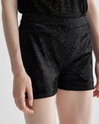 Black Helena Shorts in stretch sequin by Veronica De Piante, featuring a fitted design and shimmering sequin fabric.