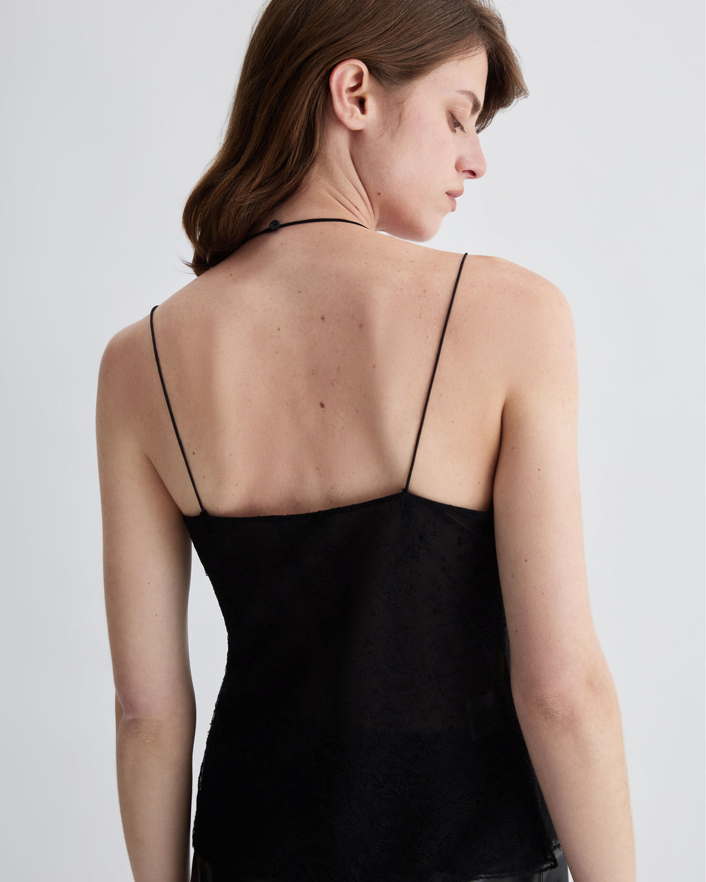 Black lace Mariana camisole top by Veronica De Piante, featuring delicate detailing and a stylish silhouette.