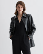 Black Jess jacket in patent leather by Veronica De Piante, stylish coat with a sleek, shiny finish and modern design.