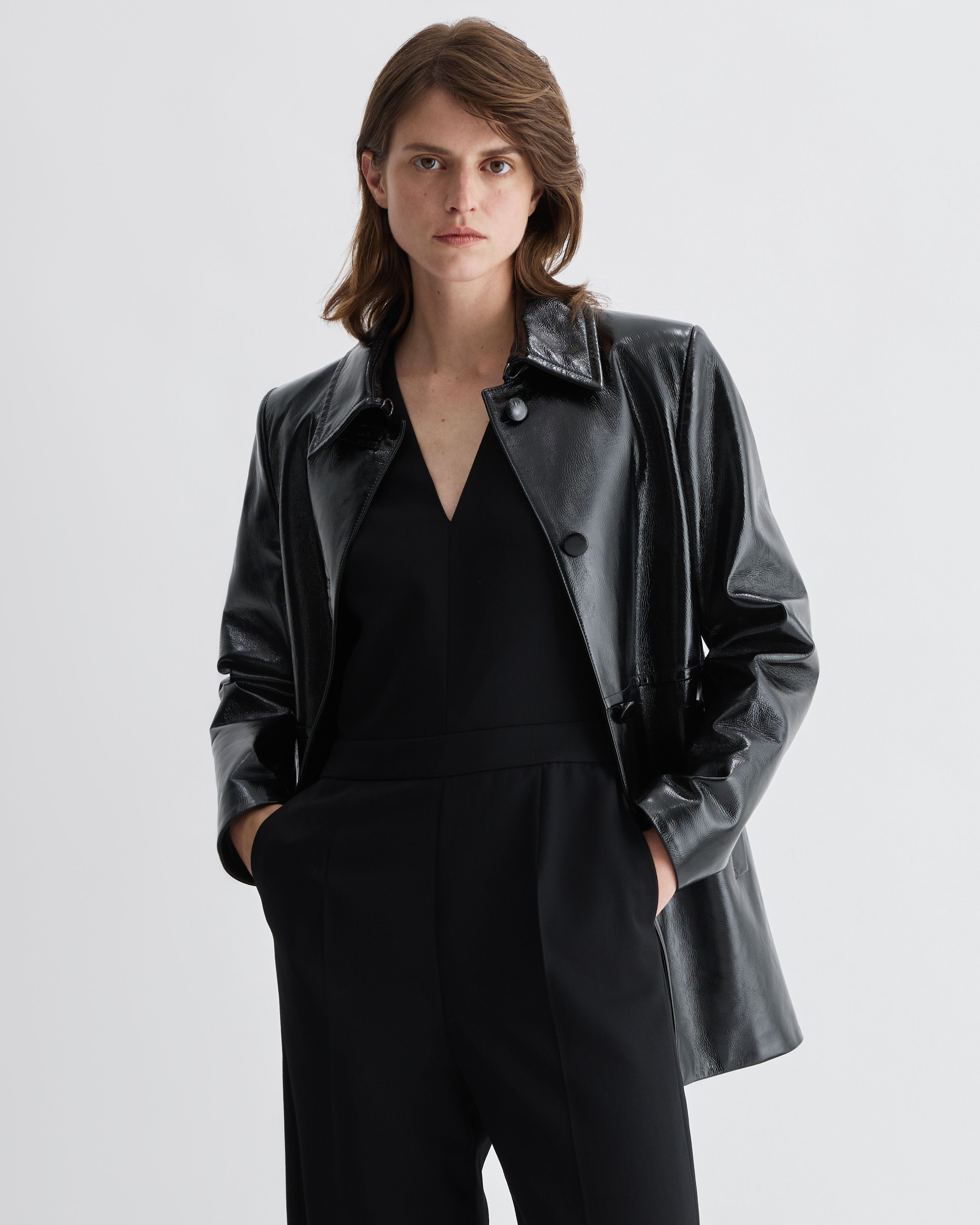 Black Jess jacket in patent leather by Veronica De Piante, stylish coat with a sleek, shiny finish and modern design.