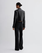 Veronica De Piante Rory black nappa leather jacket with a sleek, tailored fit, shown hanging on a hanger.