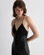 Black Amelia Dress in Nappa Leather by Veronica De Piante, showcasing a fitted sleeveless design and sleek leather texture.