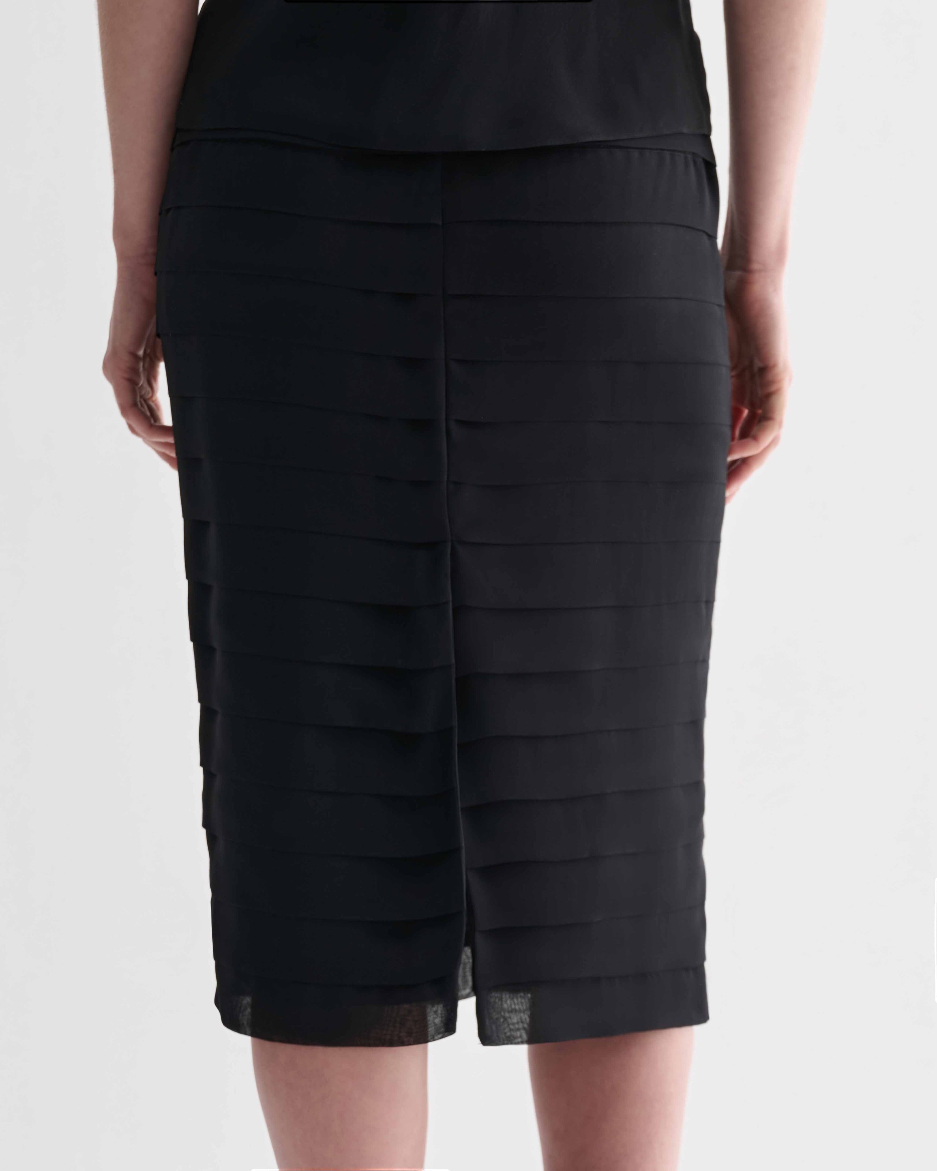 Black Adela Skirt in Georgette by Veronica De Piante, featuring flowing fabric and elegant design, shown on a model.