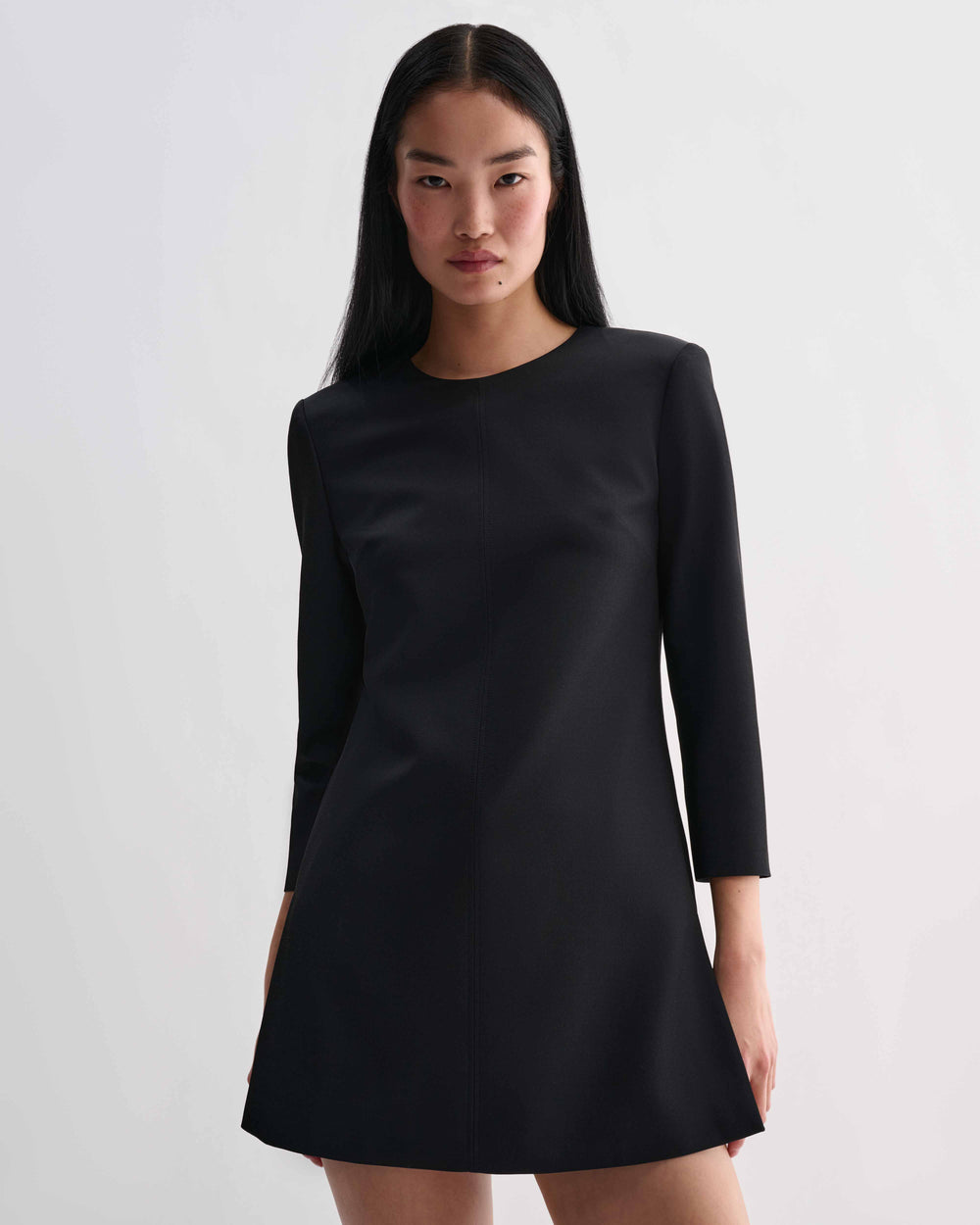 Black silk Ambar Tunic by Veronica De Piante, showcasing its elegant, flowing design and smooth fabric texture.