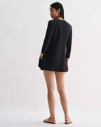 Black silk Ambar tunic by Veronica De Piante, shown hanging with a relaxed fit and smooth fabric details.