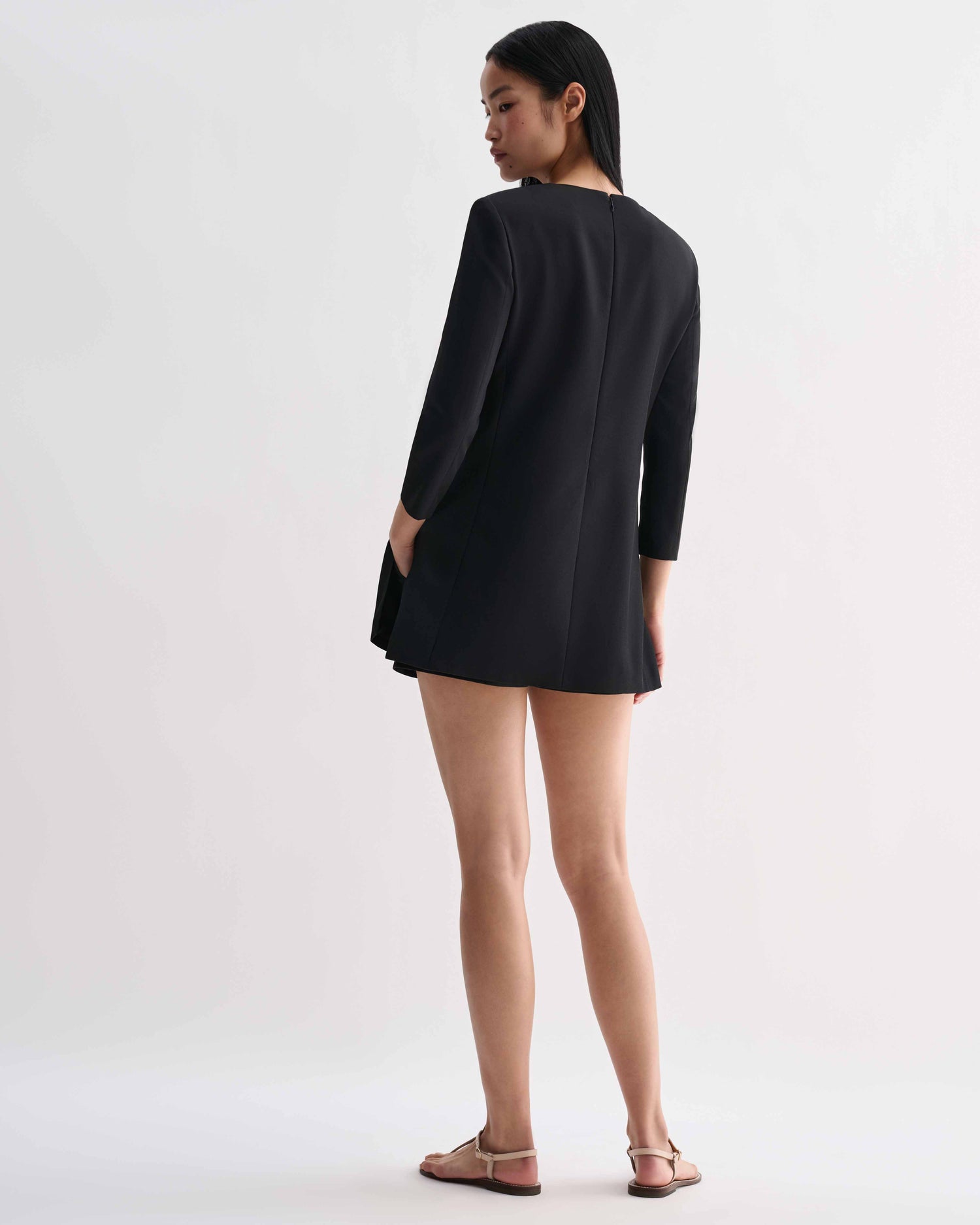 Black silk Ambar tunic by Veronica De Piante, shown hanging with a relaxed fit and smooth fabric details.