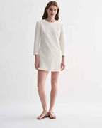 Off-white silk Ambar Tunic by Veronica De Piante, featuring flowing fabric and elegant design, displayed on a plain background.