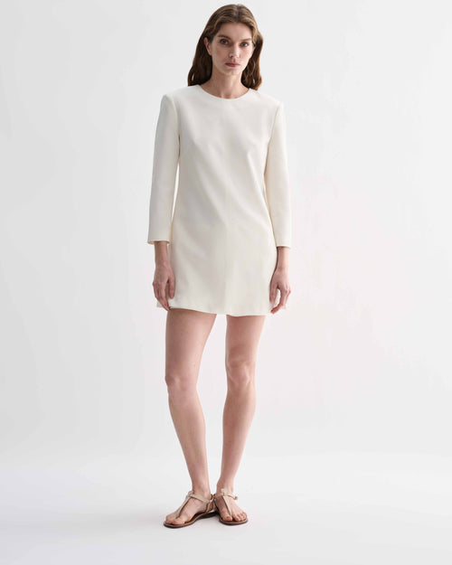 Off-white silk Ambar Tunic by Veronica De Piante, featuring flowing fabric and elegant design, displayed on a plain background.