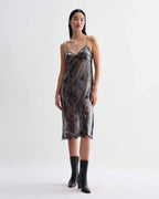 Black Veronica De Piante Aya lace sequin dress displayed on a hanger with intricate lace and sequin details.
