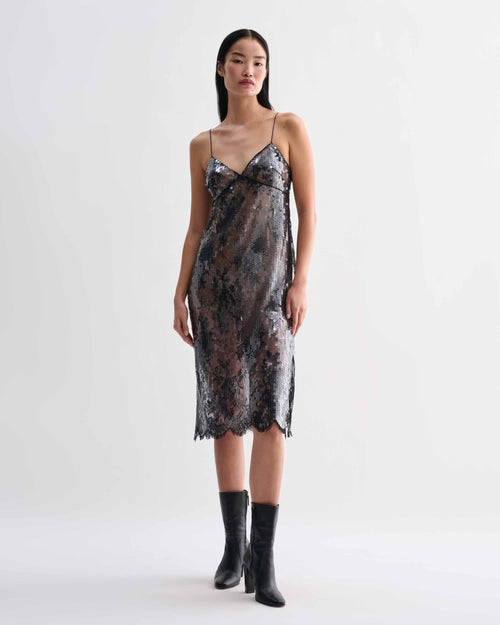 Black Veronica De Piante Aya lace sequin dress displayed on a hanger with intricate lace and sequin details.