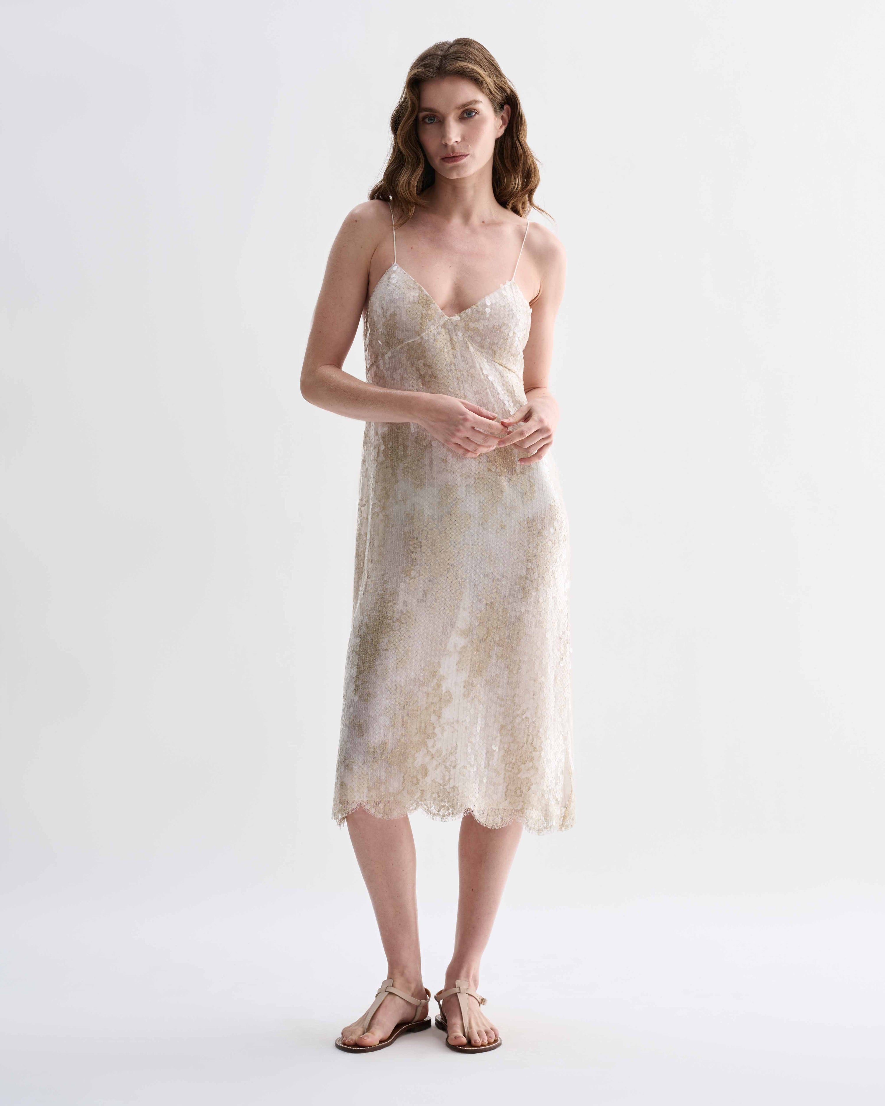 Veronica De Piante Aya dress in gold lace and sequins, elegant evening dress with intricate details and a flowing silhouette.