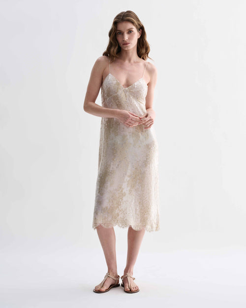 Veronica De Piante Aya dress in gold lace and sequins, elegant evening dress with intricate details and a flowing silhouette.