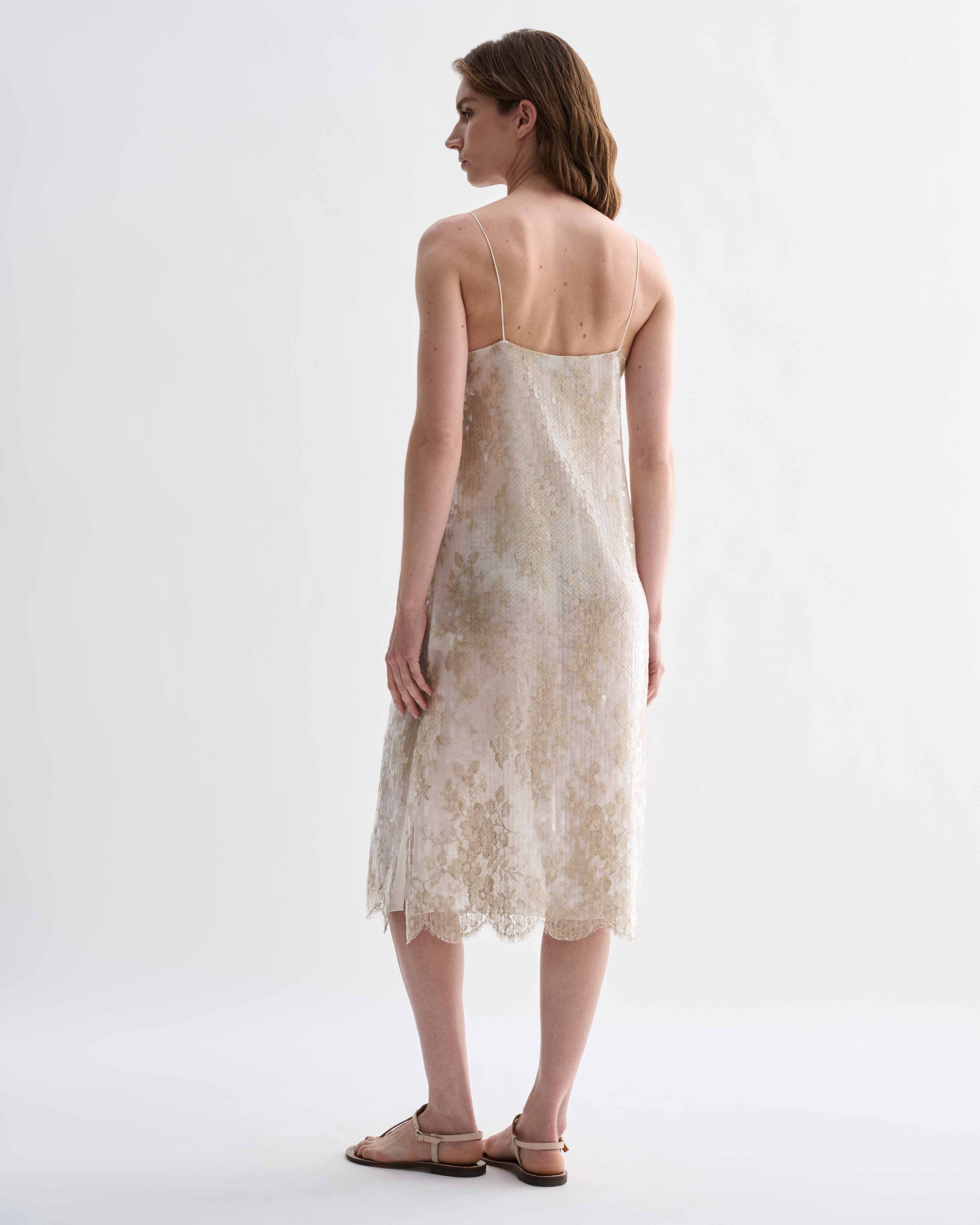 Gold lace and sequin Aya dress by Veronica De Piante, featuring intricate fabric details and a stylish, elegant design.