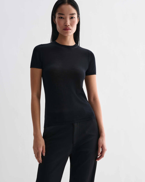 Veronica De Piante Bea Knit Top in black, made from superfine merino wool, showcasing a close-up of the soft, fitted knit fabric.