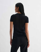 Black Bea Knit Top by Veronica De Piante, made from superfine merino wool, shown on a model with long sleeves and a fitted design.