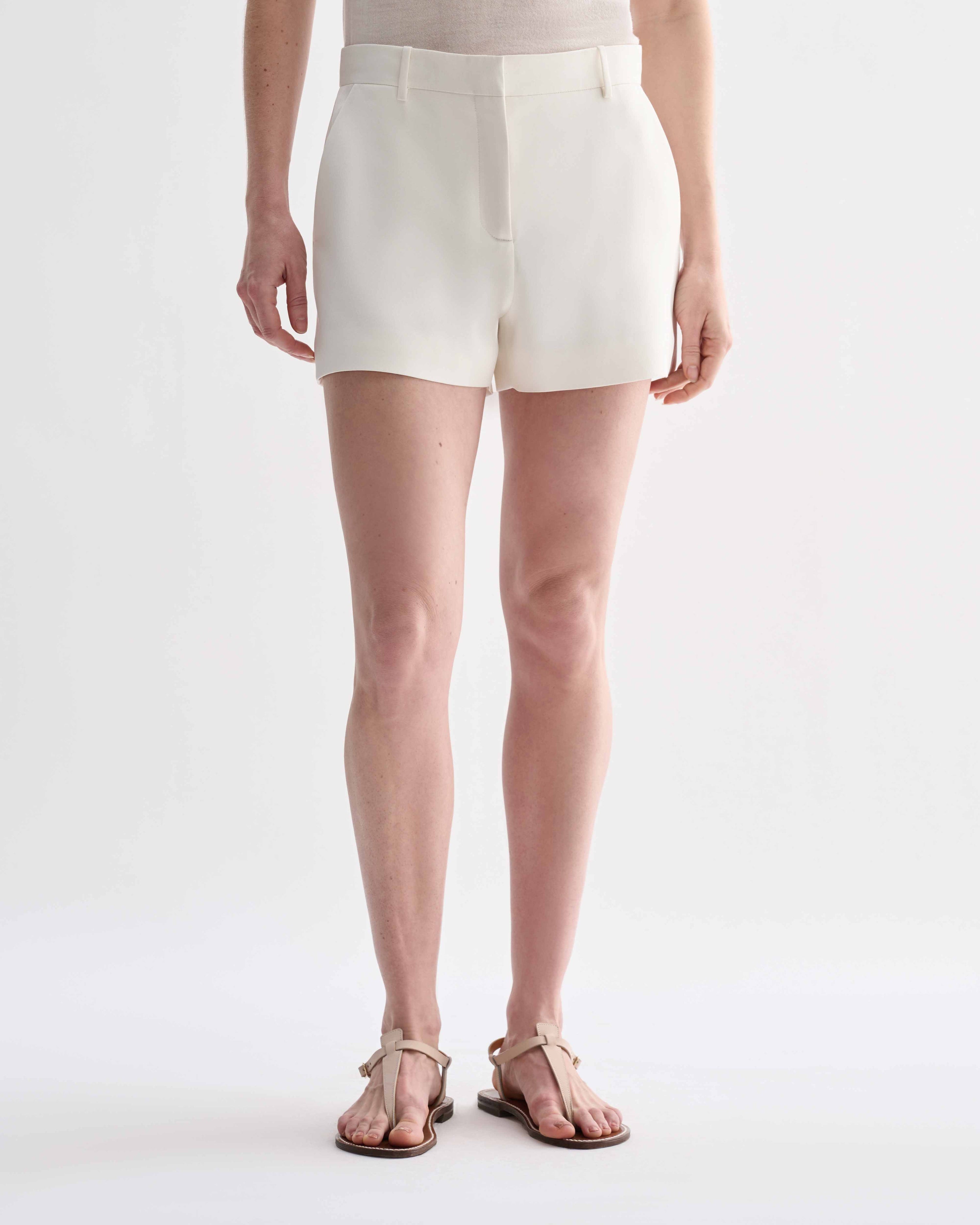 Off-white silk Belle Shorts by Veronica De Piante featuring a relaxed fit and elegant design, displayed on a neutral background.