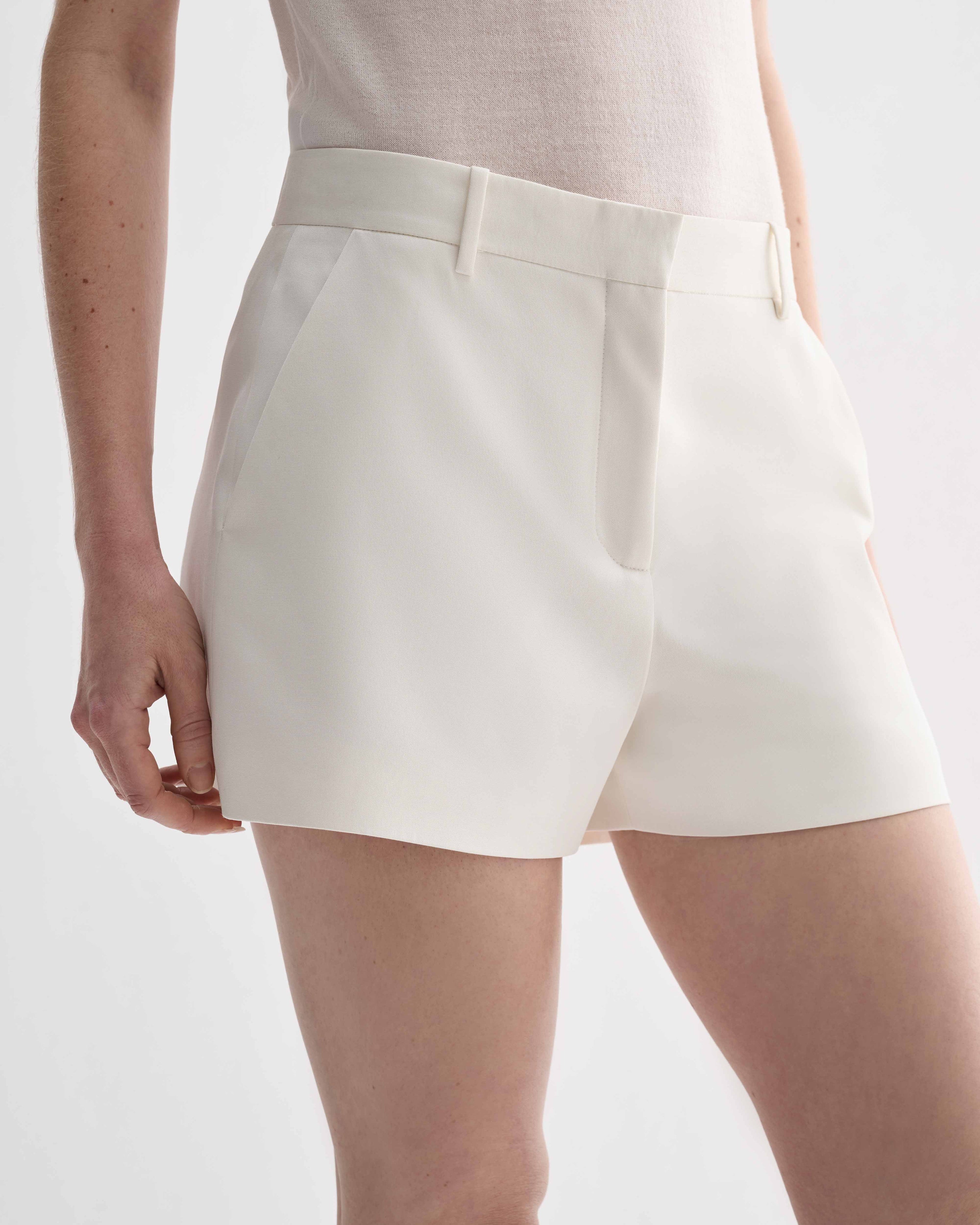 Off-white silk Belle Shorts by Veronica De Piante, featuring a relaxed fit and elegant design, shown on a neutral background.