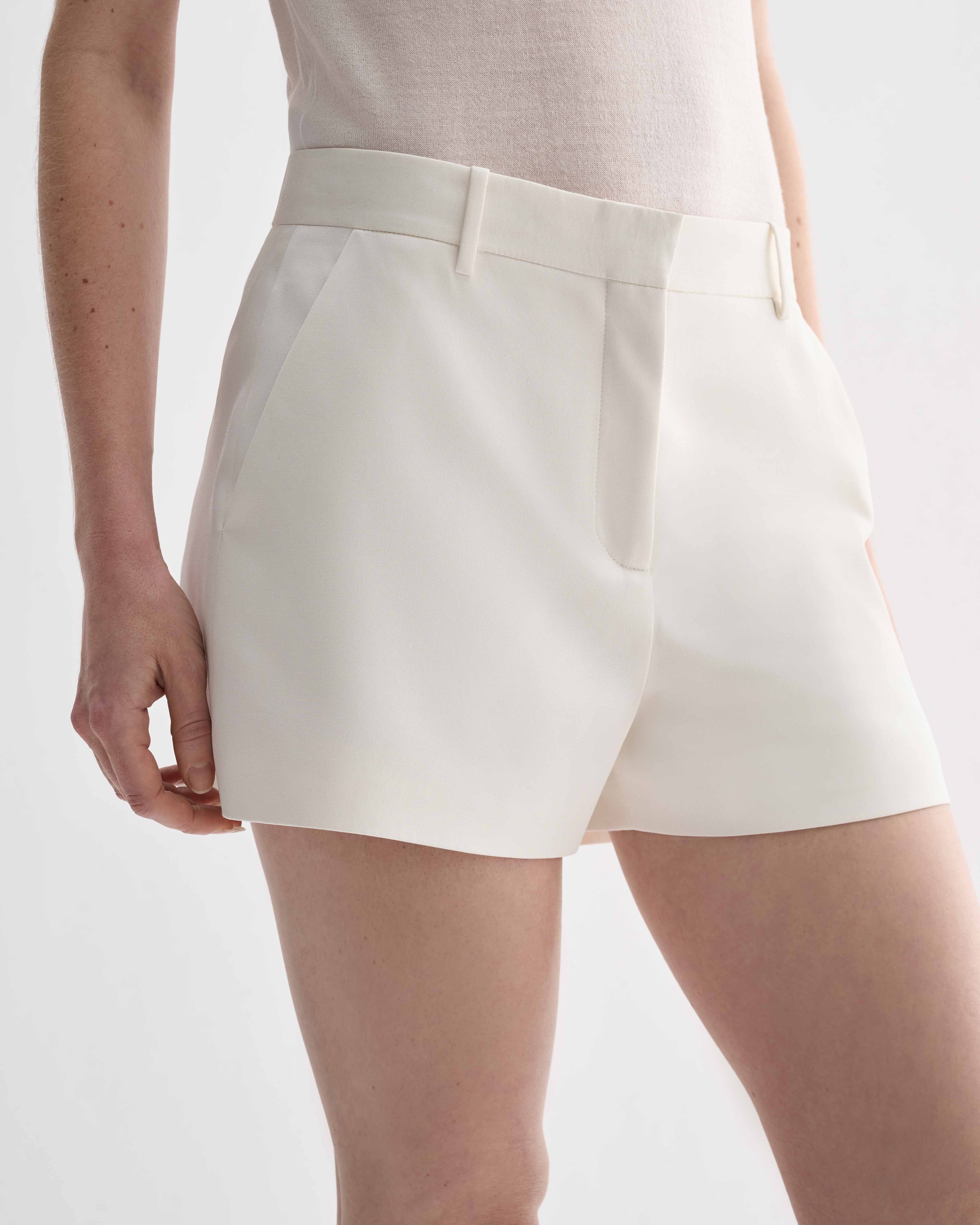 Off-white silk Belle Shorts by Veronica De Piante, featuring a relaxed fit and elegant design, shown on a neutral background.