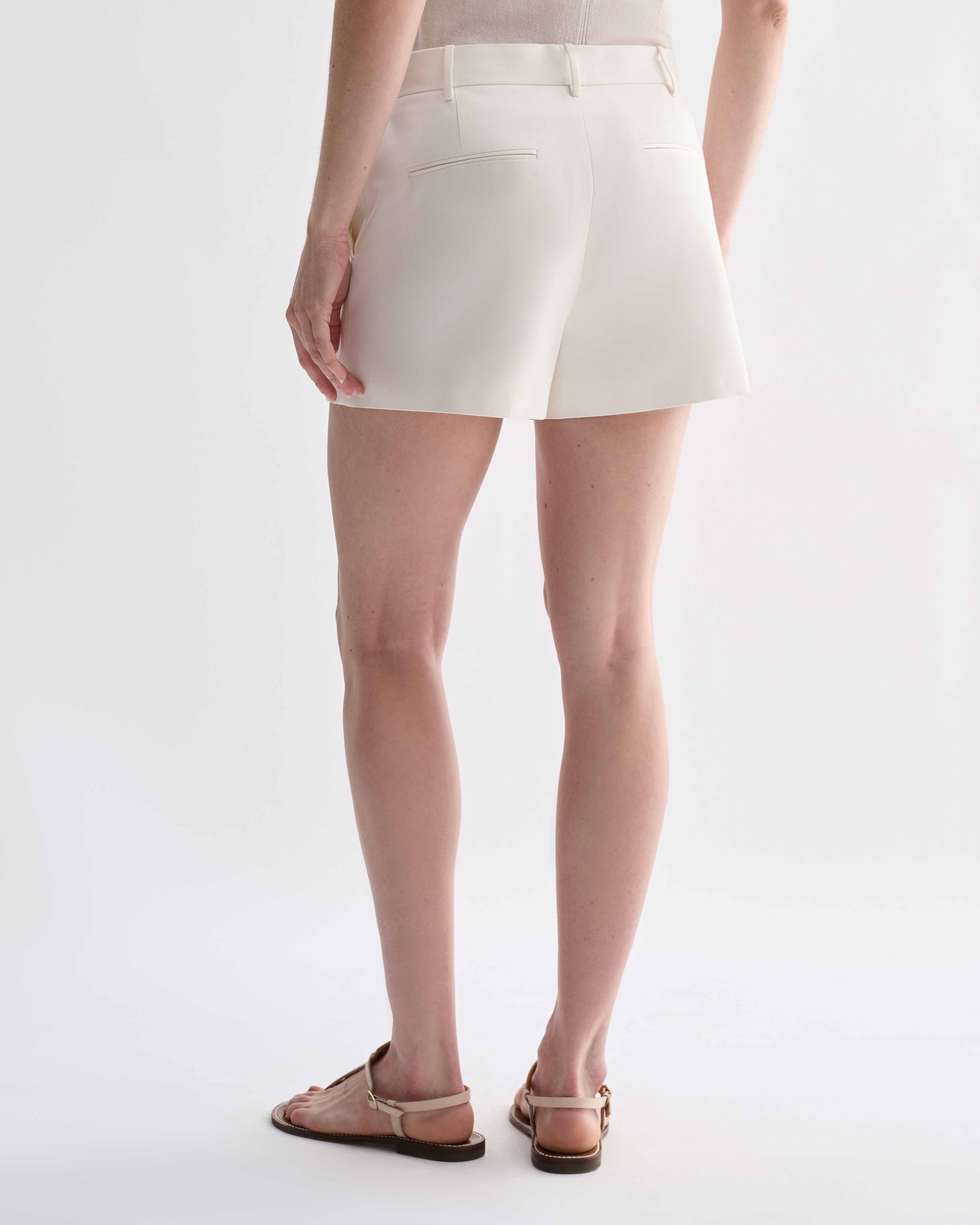 Off-white silk Belle Shorts by Veronica De Piante, featuring a relaxed fit and elegant waistband, displayed on a neutral background.