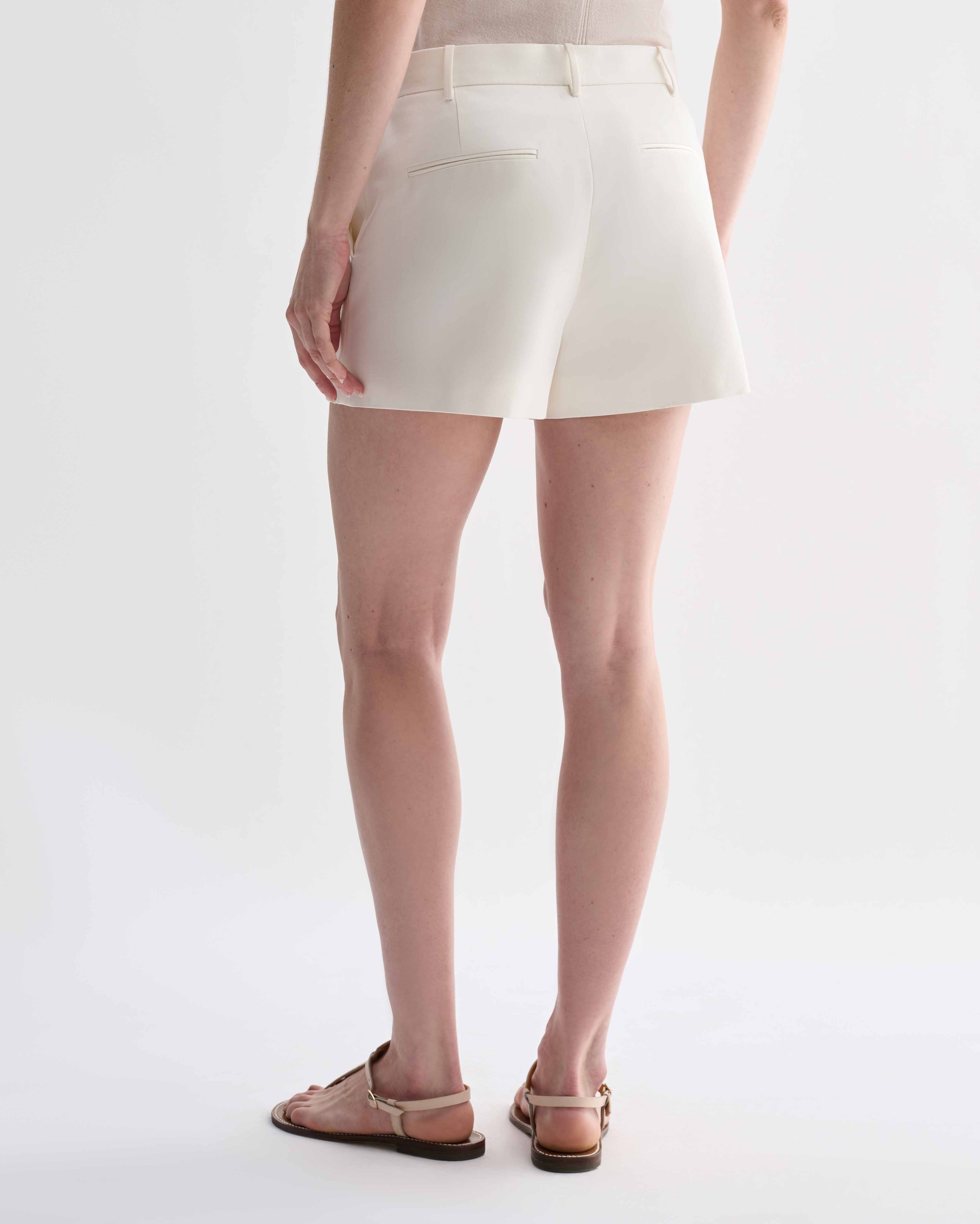Off-white silk Belle Shorts by Veronica De Piante, featuring a relaxed fit and elegant waistband, displayed on a neutral background.