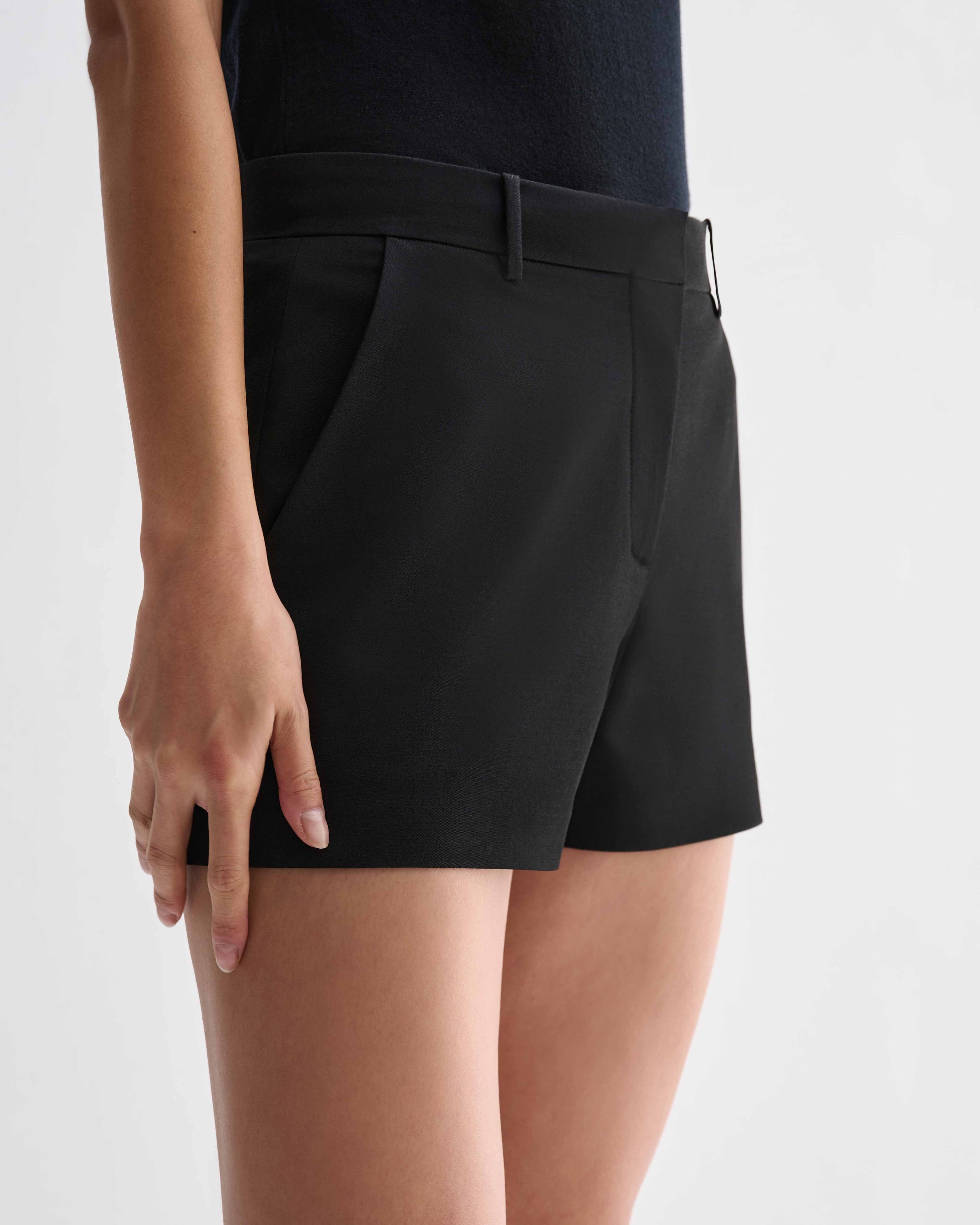 Black silk Belle Shorts by Veronica De Piante, featuring smooth fabric and stylish design, shown on a neutral background.