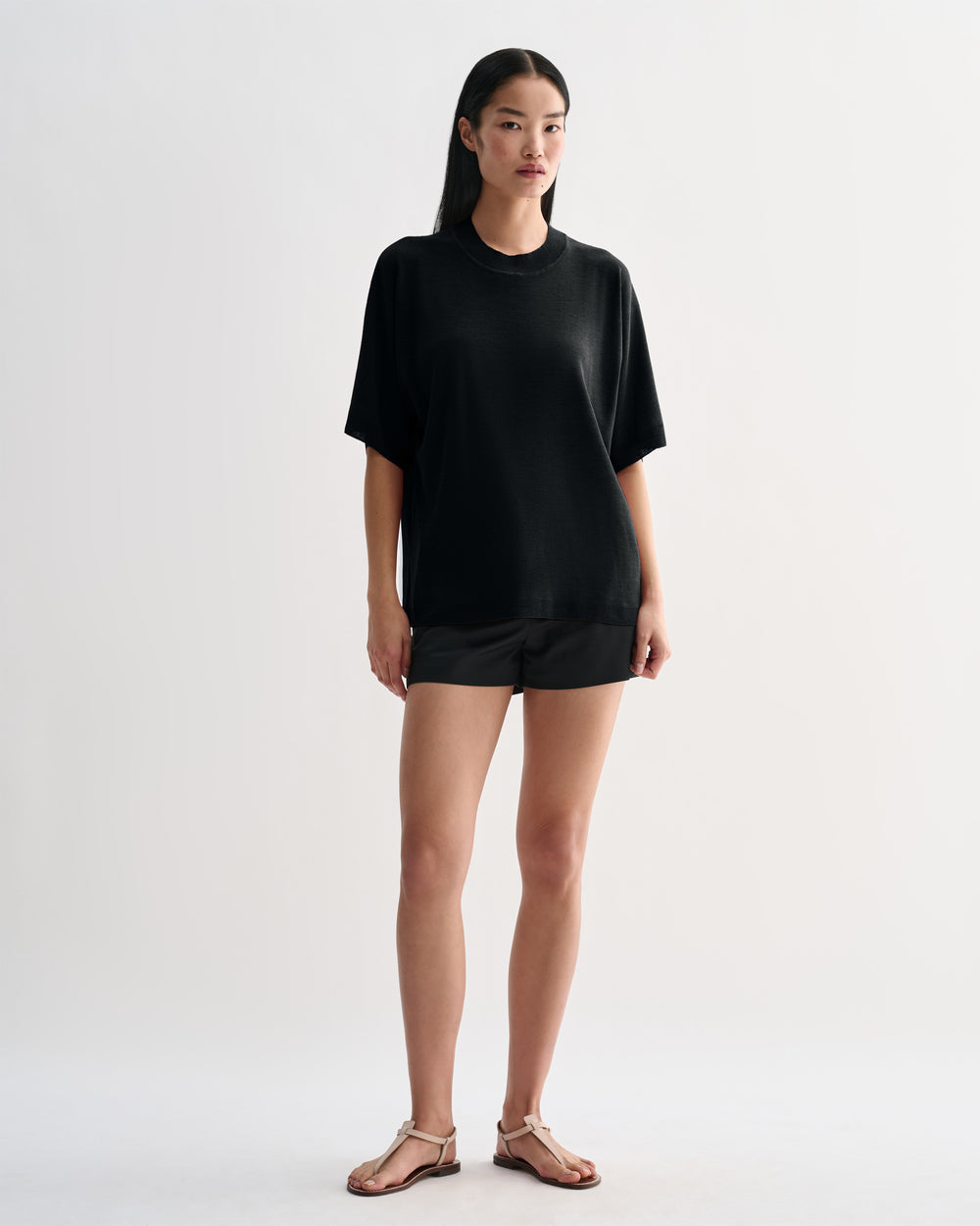 Black Carys knit top by Veronica De Piante, showing a fitted Viscose blouse with long sleeves and a round neckline.