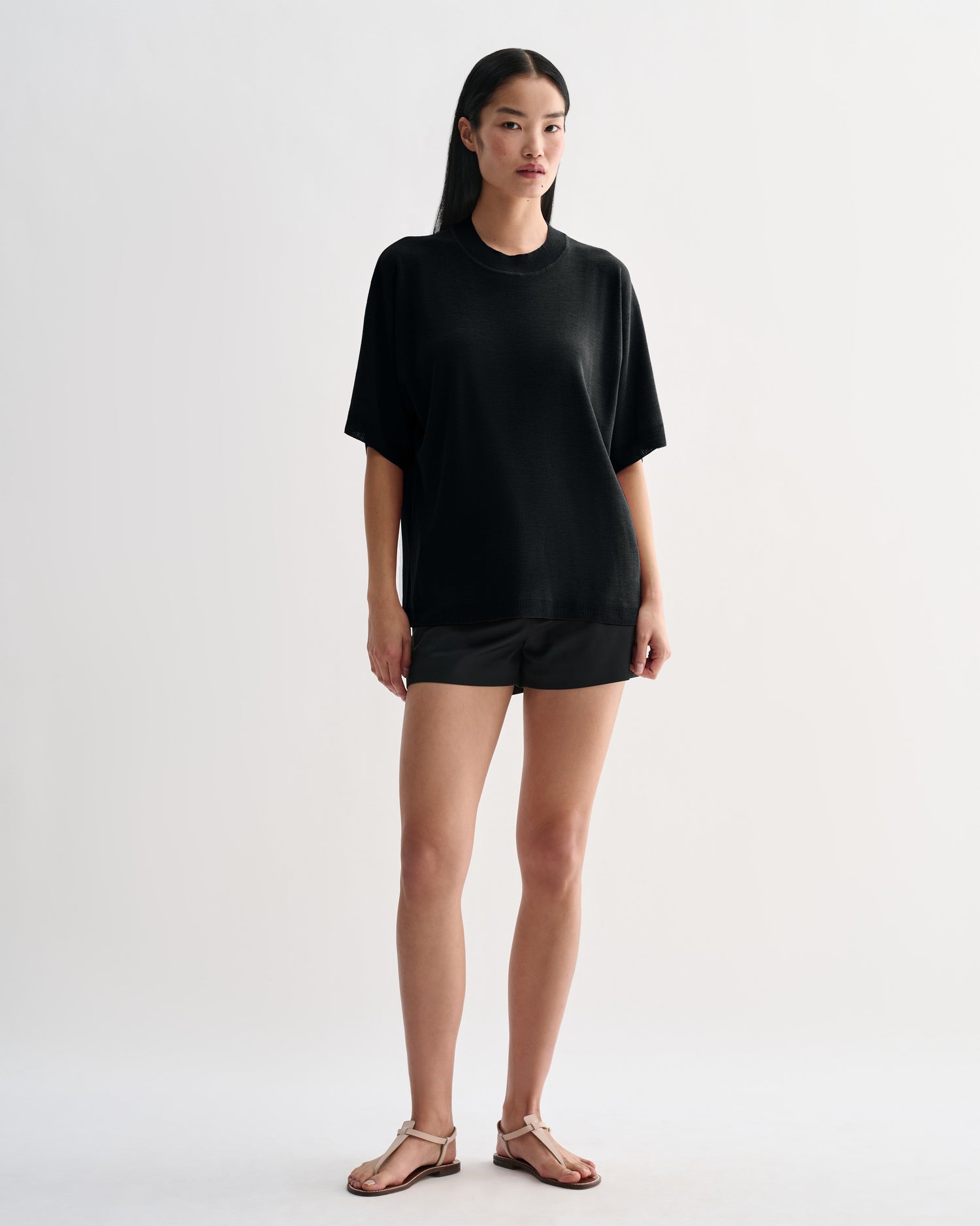 Black Carys knit top by Veronica De Piante, showing a fitted Viscose blouse with long sleeves and a round neckline.