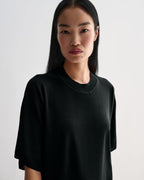 Black Carys knit top by Veronica De Piante, featuring a soft viscose fabric and stylish fit, displayed on a neutral background.