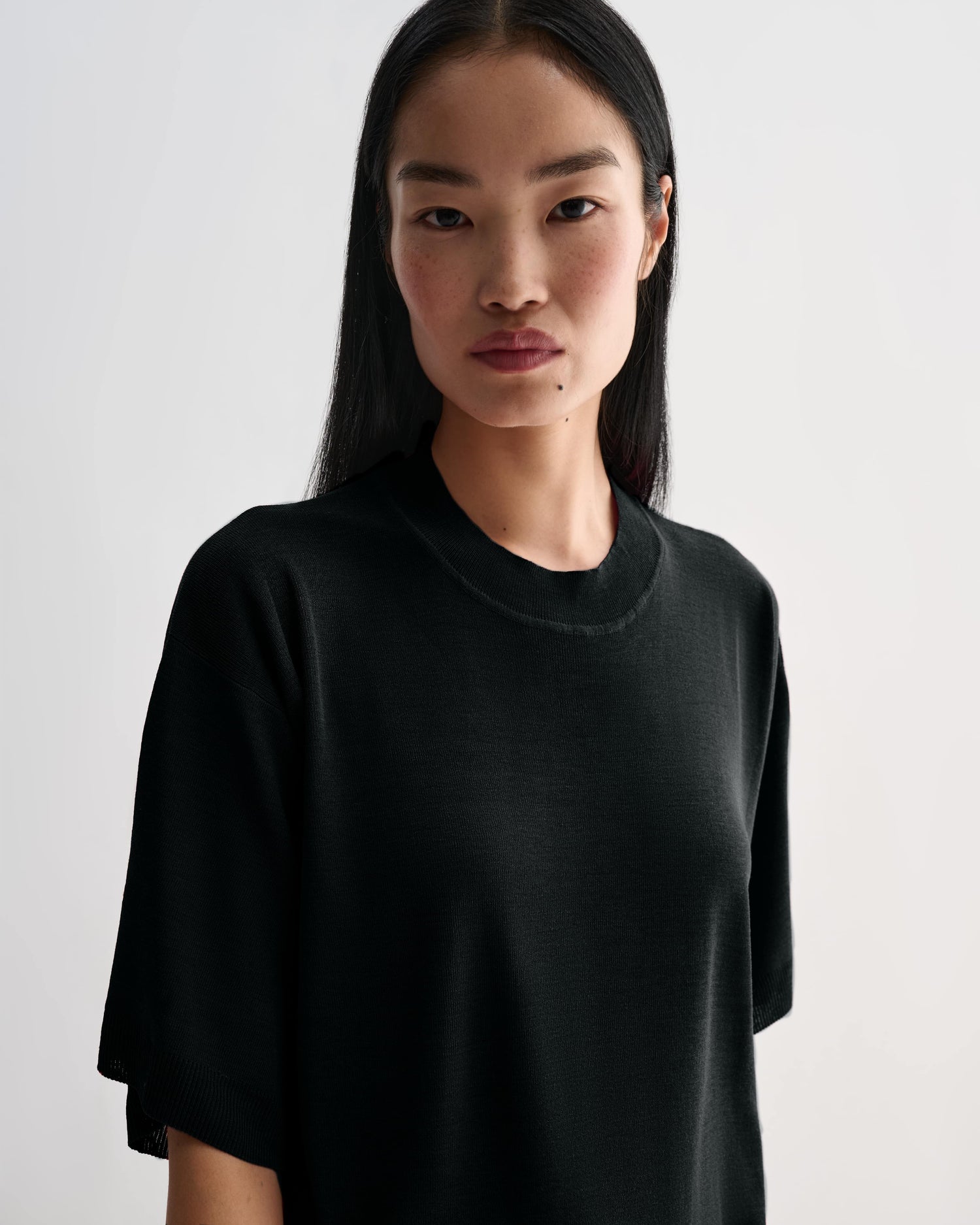 Black Carys knit top by Veronica De Piante, featuring a soft viscose fabric and stylish fit, displayed on a neutral background.