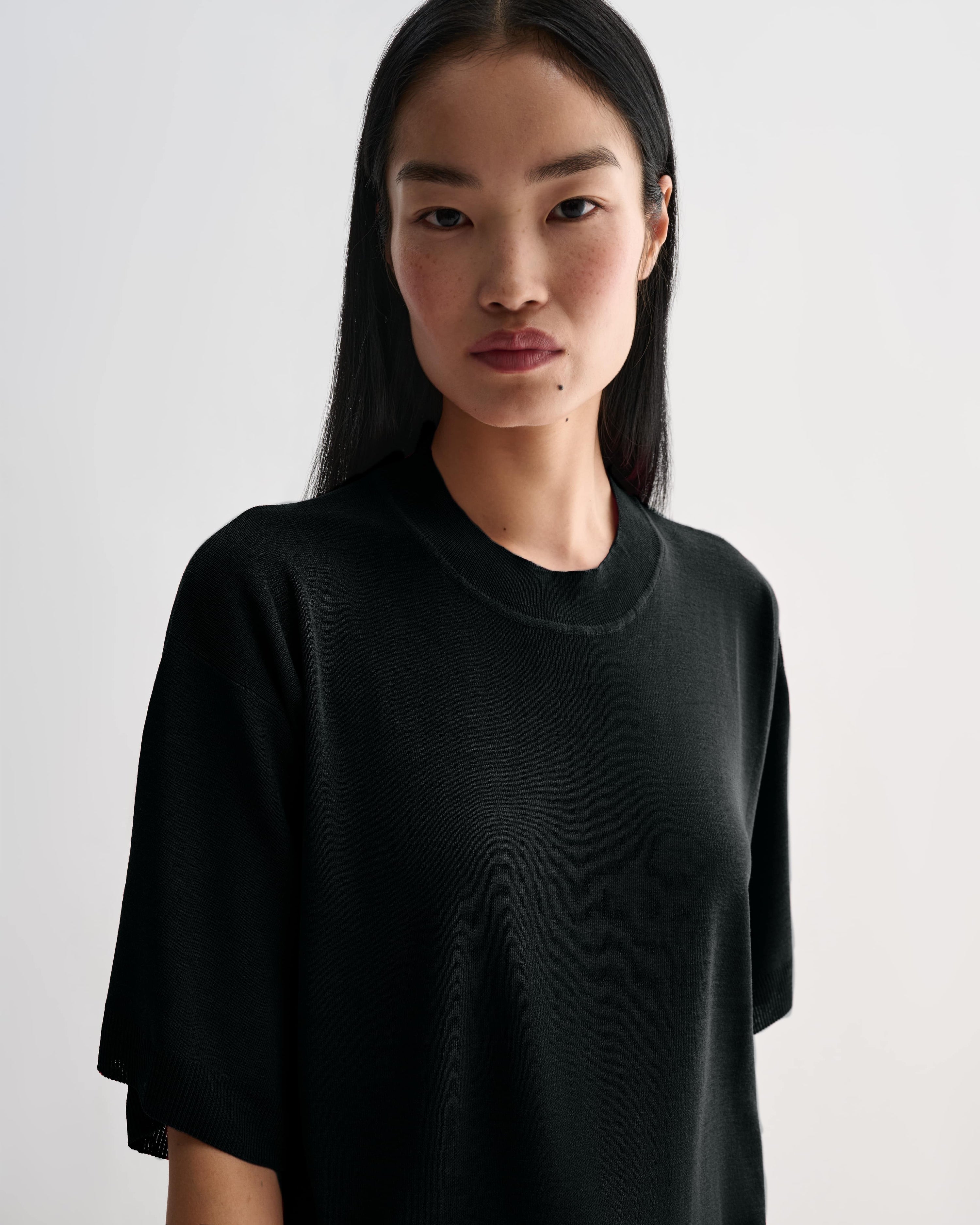 Black Carys knit top by Veronica De Piante, featuring a soft viscose fabric and stylish fit, displayed on a neutral background.