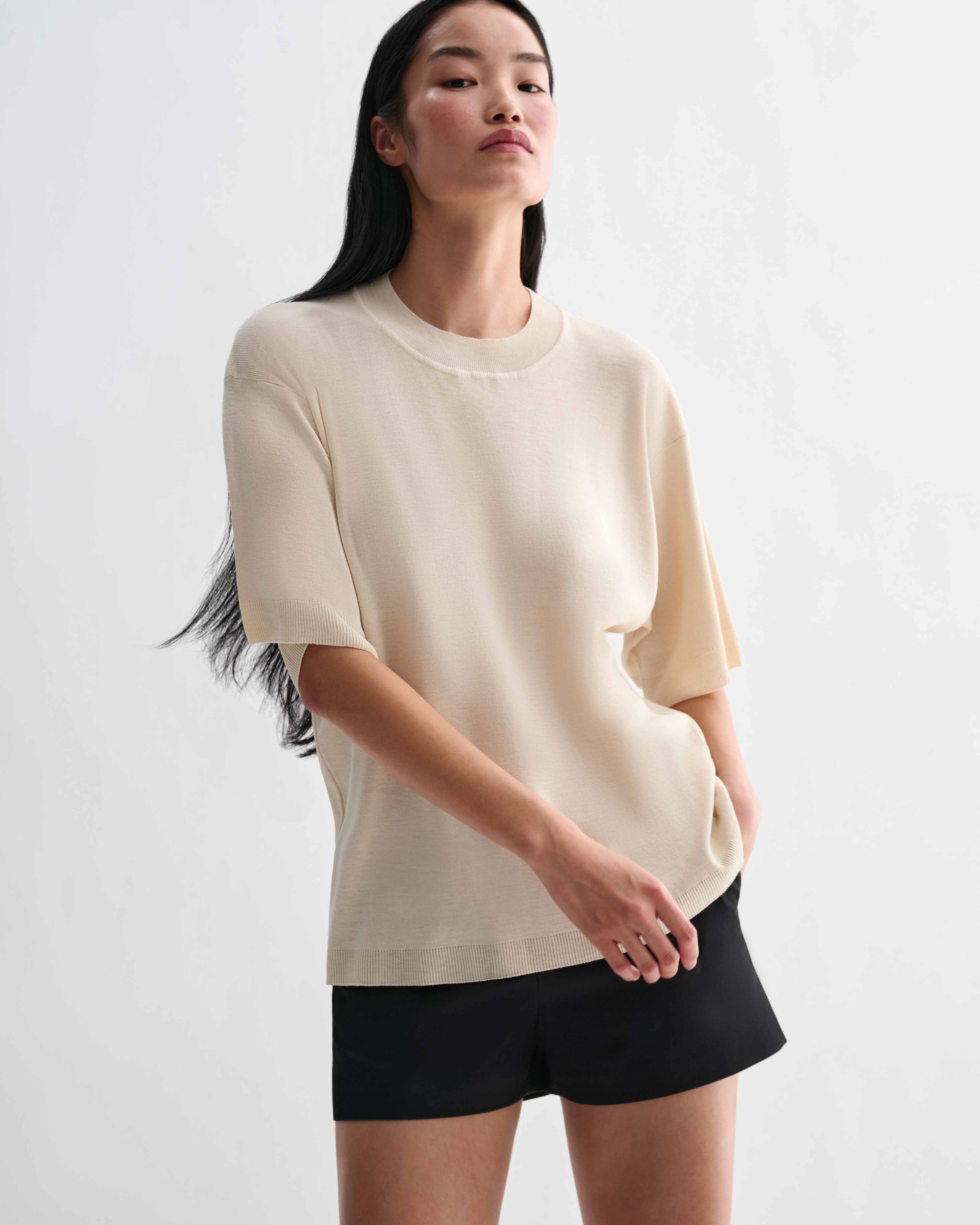Off-white Carys Knit T-Shirt by Veronica De Piante, featuring a soft viscose fabric and a relaxed fit, styled as a casual top.