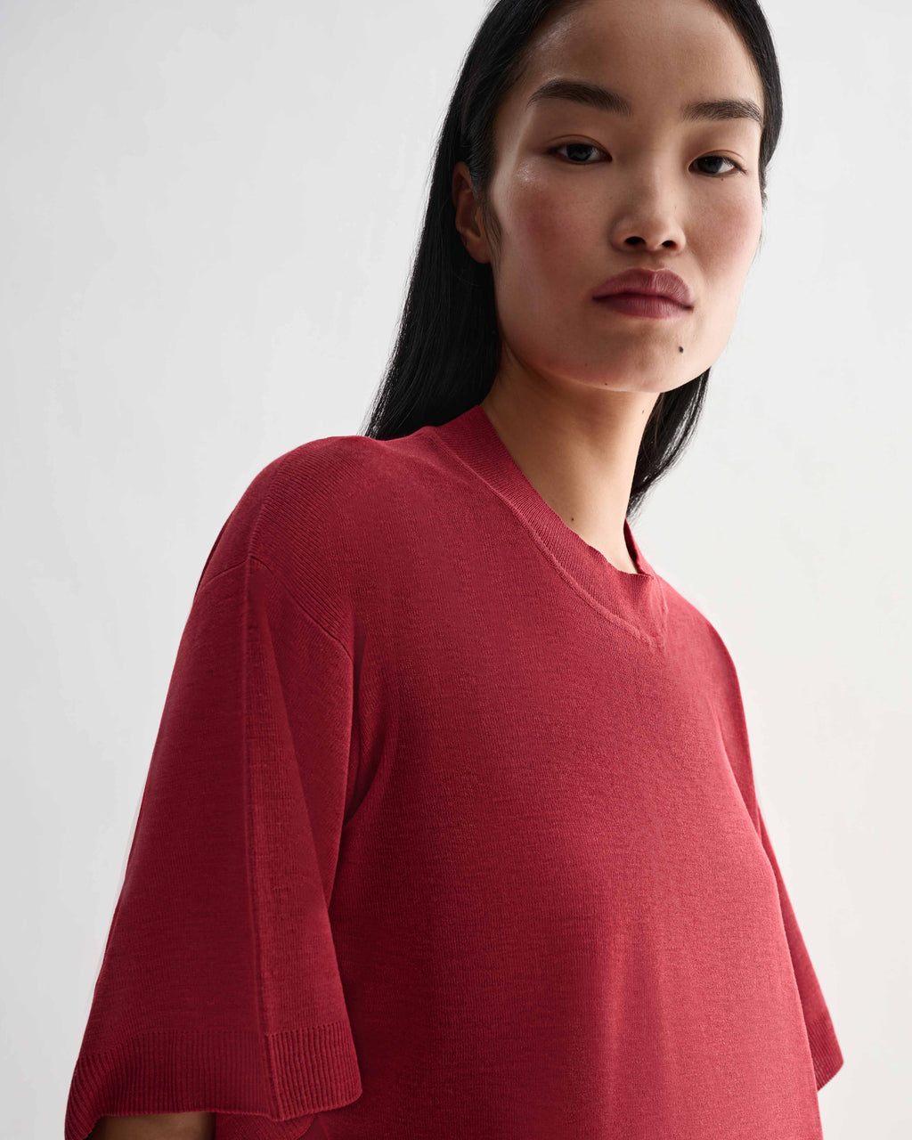 Red Carys knit T-shirt by Veronica De Piante, made of viscose, shown with short sleeves and a relaxed fit.