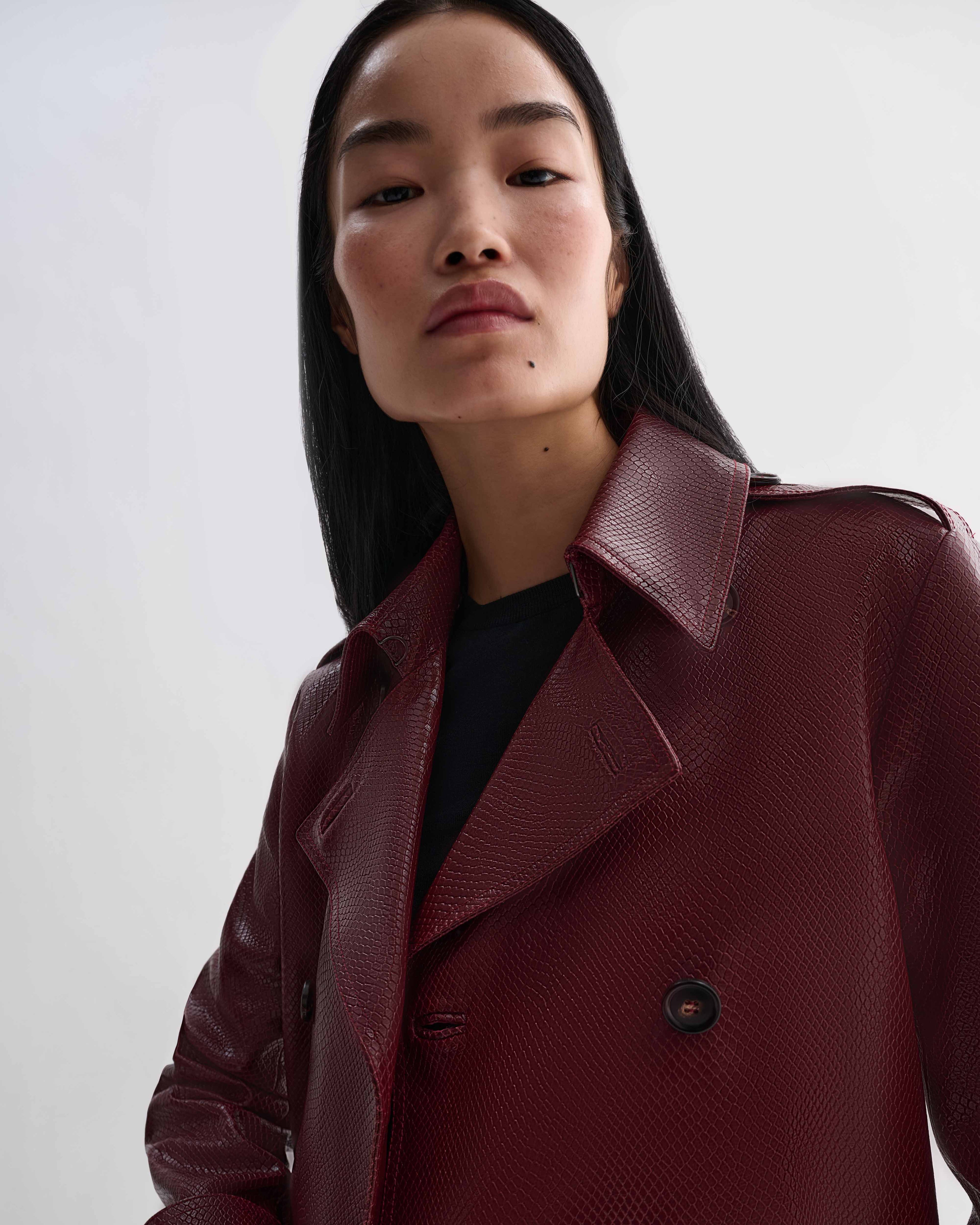 Charlotte Trench dark red embossed leather snakeskin trench coat worn by model Luxury outerwear