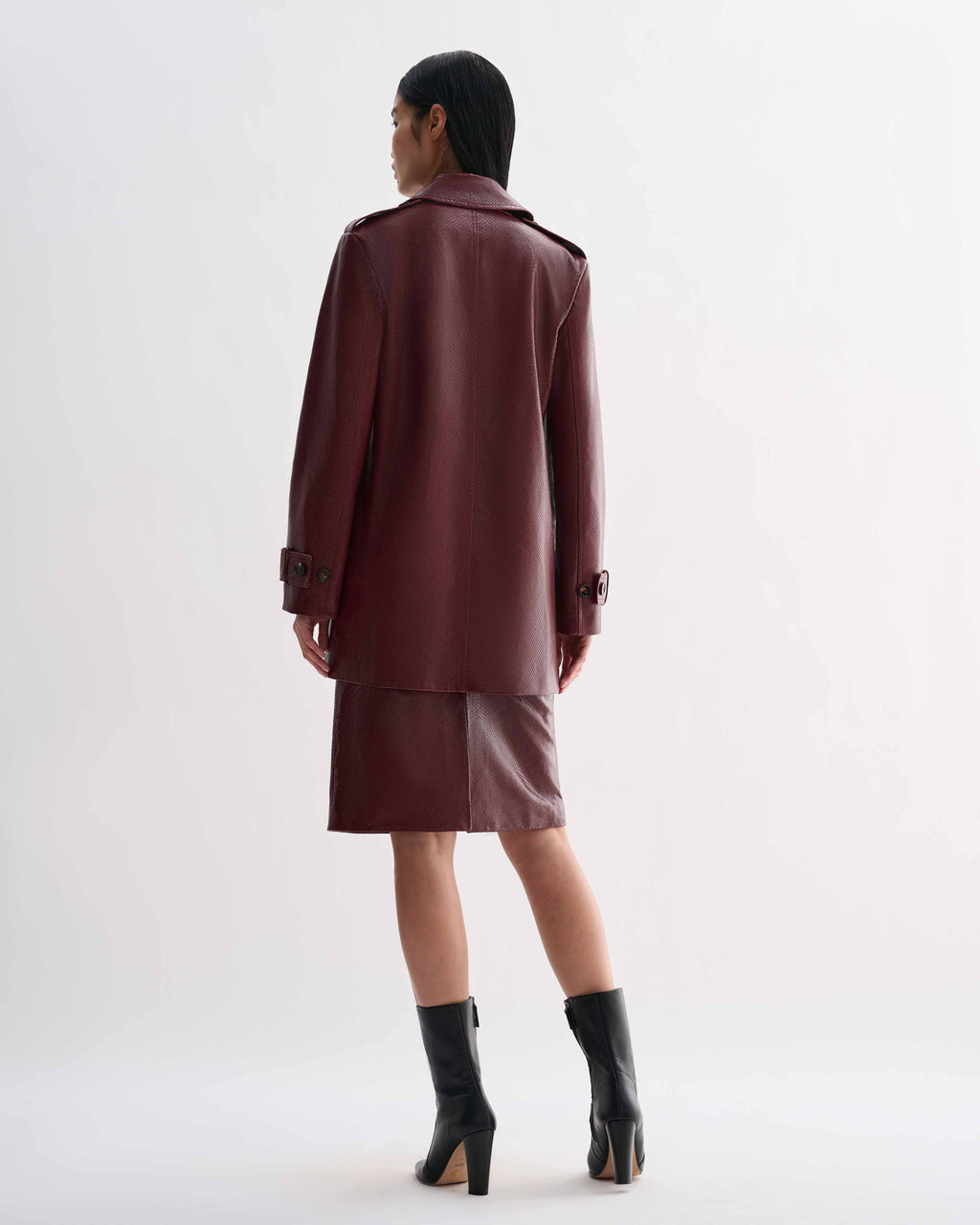 Dark red Charlotte Trench embossed leather trench coat, snakeskin pattern, worn by model from back
