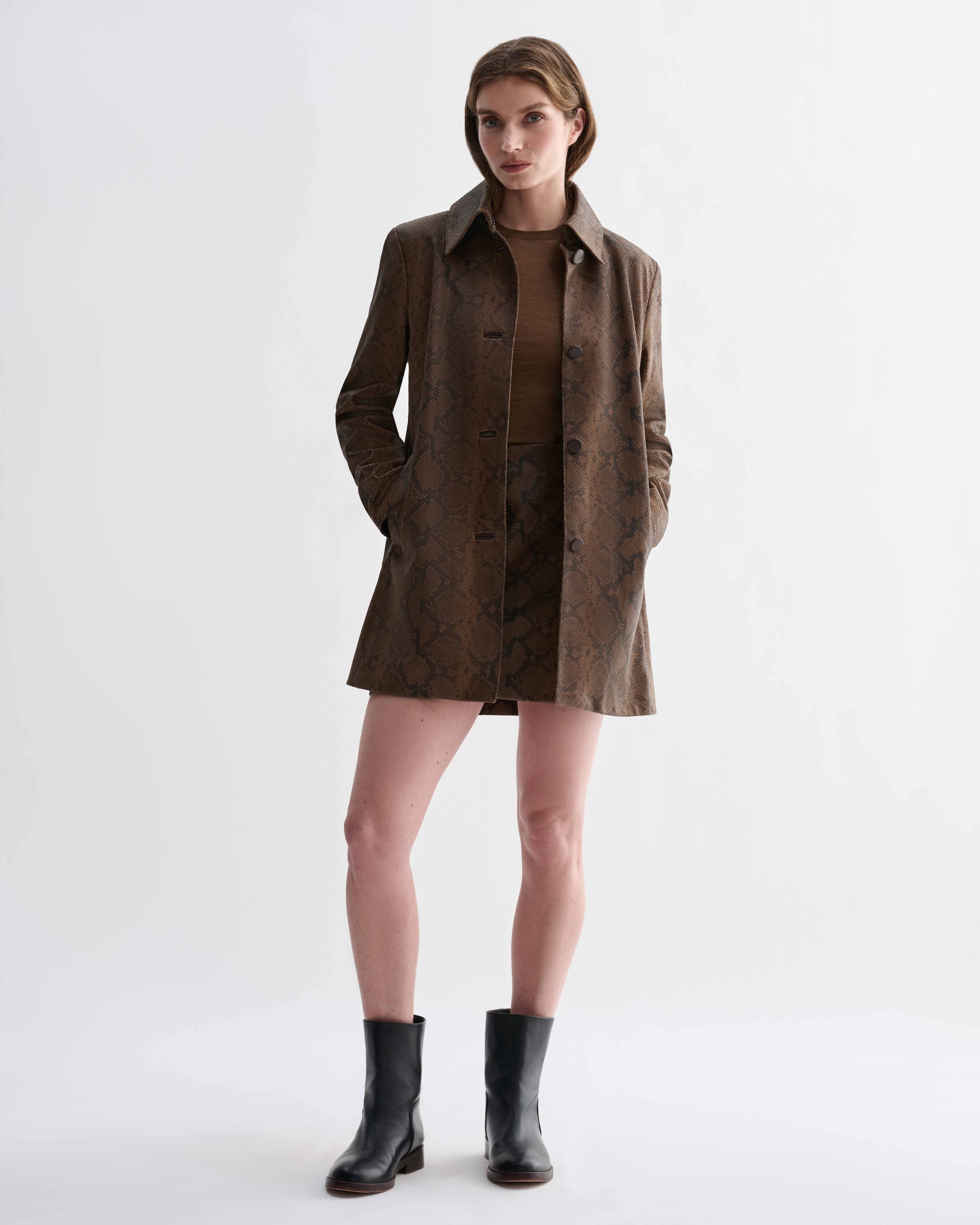 Model wears Chiara Coat: camel snake print embossed goatskin leather tailored jacket, direct fit, luxury city shell