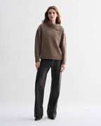 Cielo Sweater in Camel Wool Cashmere, chunky knit, relaxed fit, adjustable side horn buttons on model
