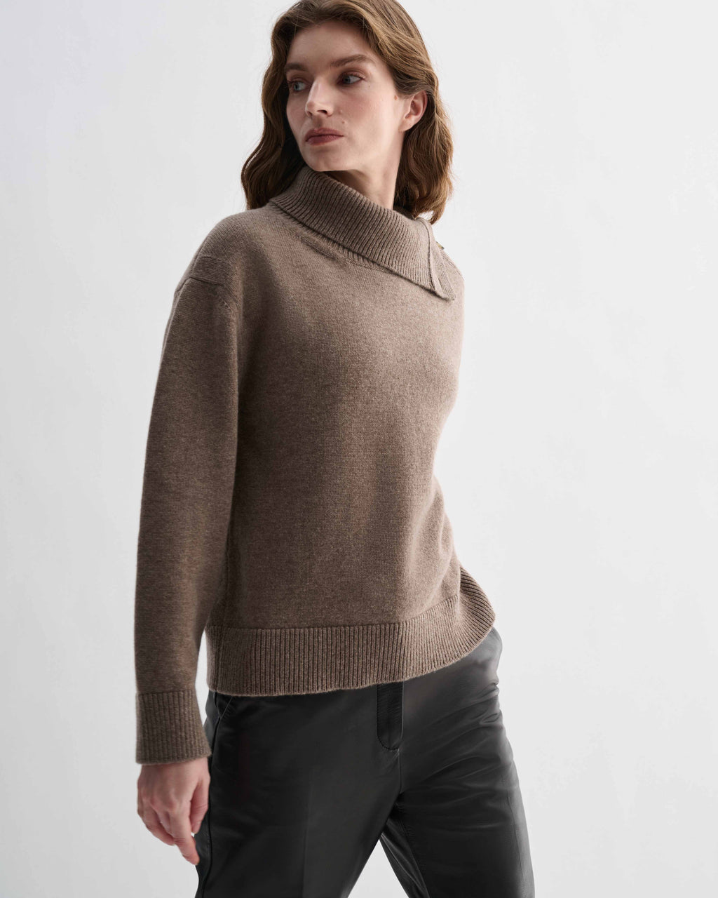 Camel wool cashmere Cielo sweater, chunky knit, relaxed fit. Features adjustable side buttoning neckline with horn buttons