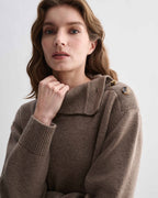 Model wearing Cielo Camel Wool Cashmere chunky knit sweater. Features side horn buttons and adjustable neckline, relaxed fit